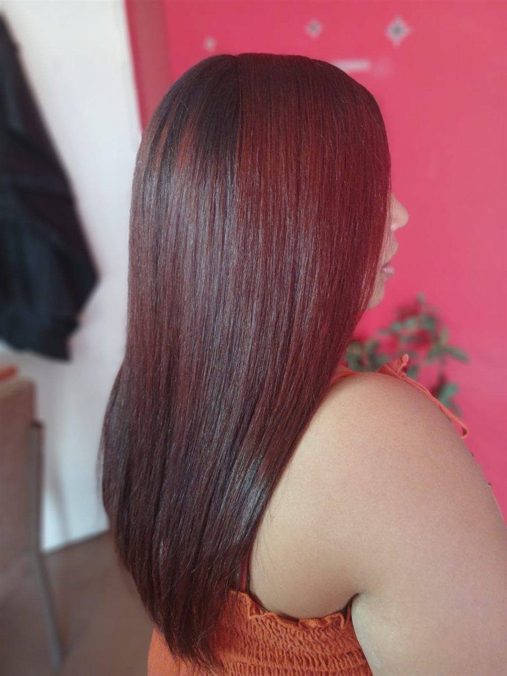 Sleek, glossy hair result styled at Hair By Mimmie