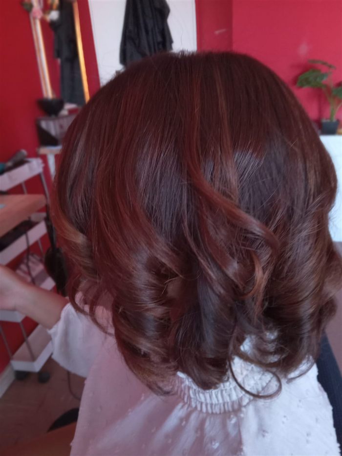 Bouncy curls styled at Hair By Mimmie